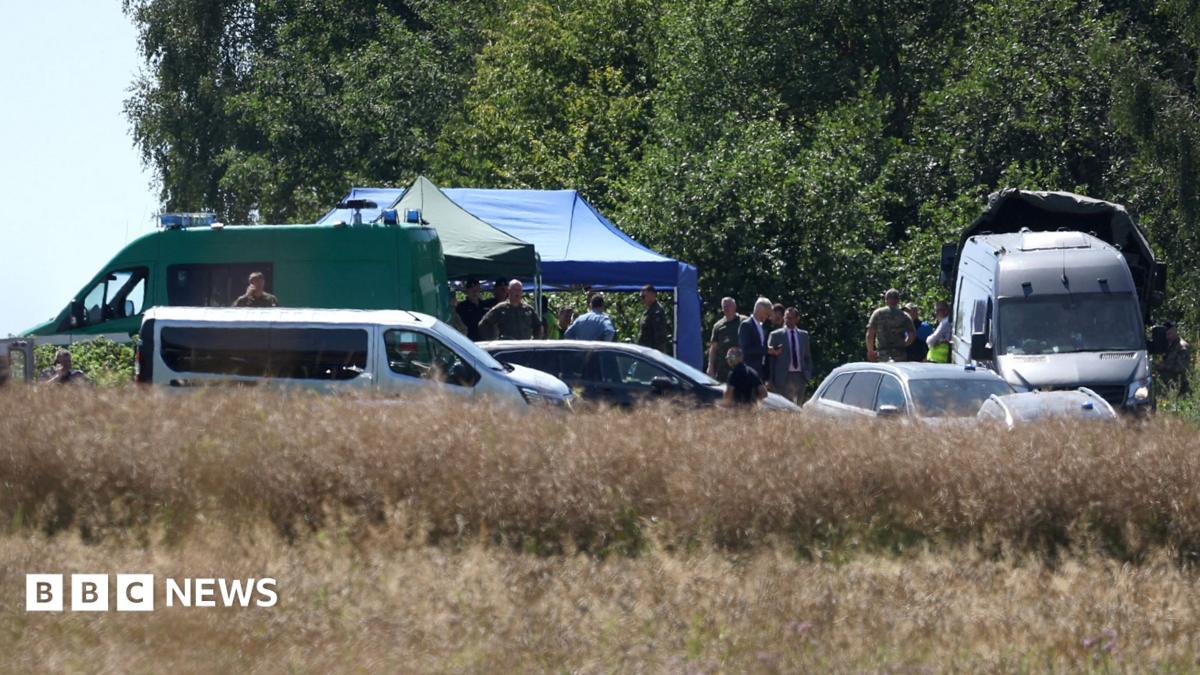Emergency services work at the site where an unidentified flying object, believed to be a Russian cruise missile, as Ukraine's foreign minister said on Thursday, fell after violating Polish airspace