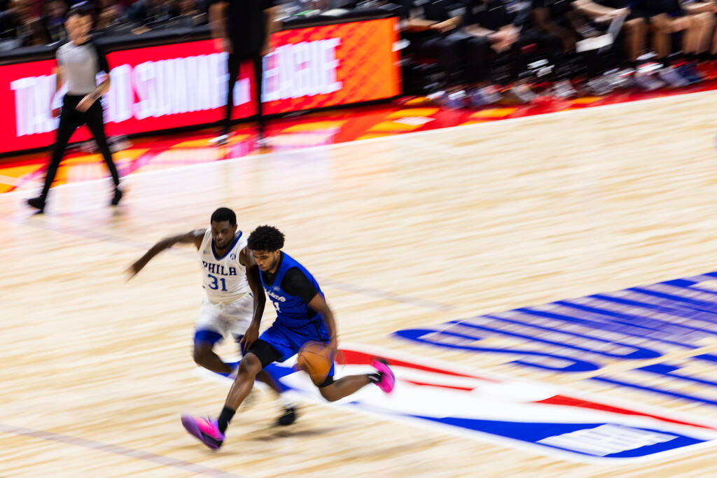 Orlando Magic guard Jase Richardson (11) brings the ball up the court while fighting Philadelph ...