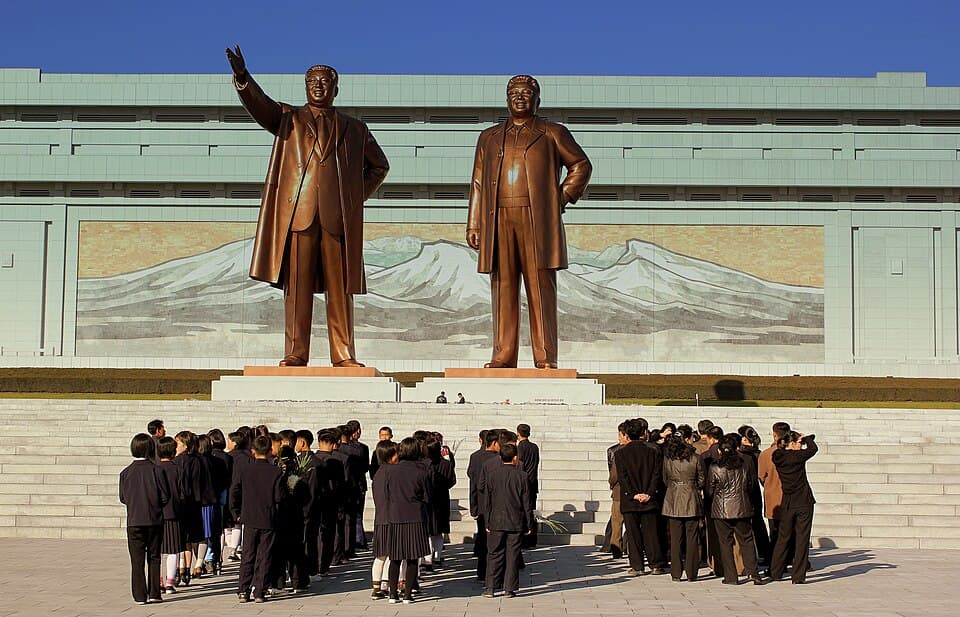 Crowds bow before the bronze statues of Kim Il Sung and Kim Jong Il at Mansudae Grand Monument, Pyongyang, October 2012