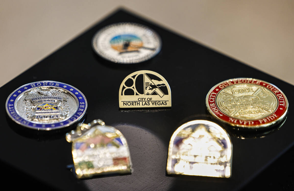 Pins representing various North Las Vegas organizations and events are photographed at an exhib ...