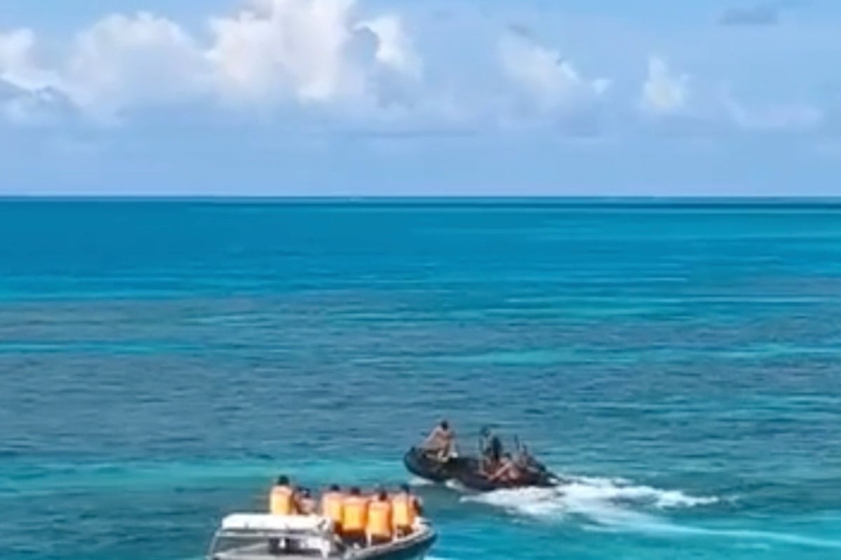 Philippines condemns Chinese coast guard for injuring Filipino sailor in disputed shoal