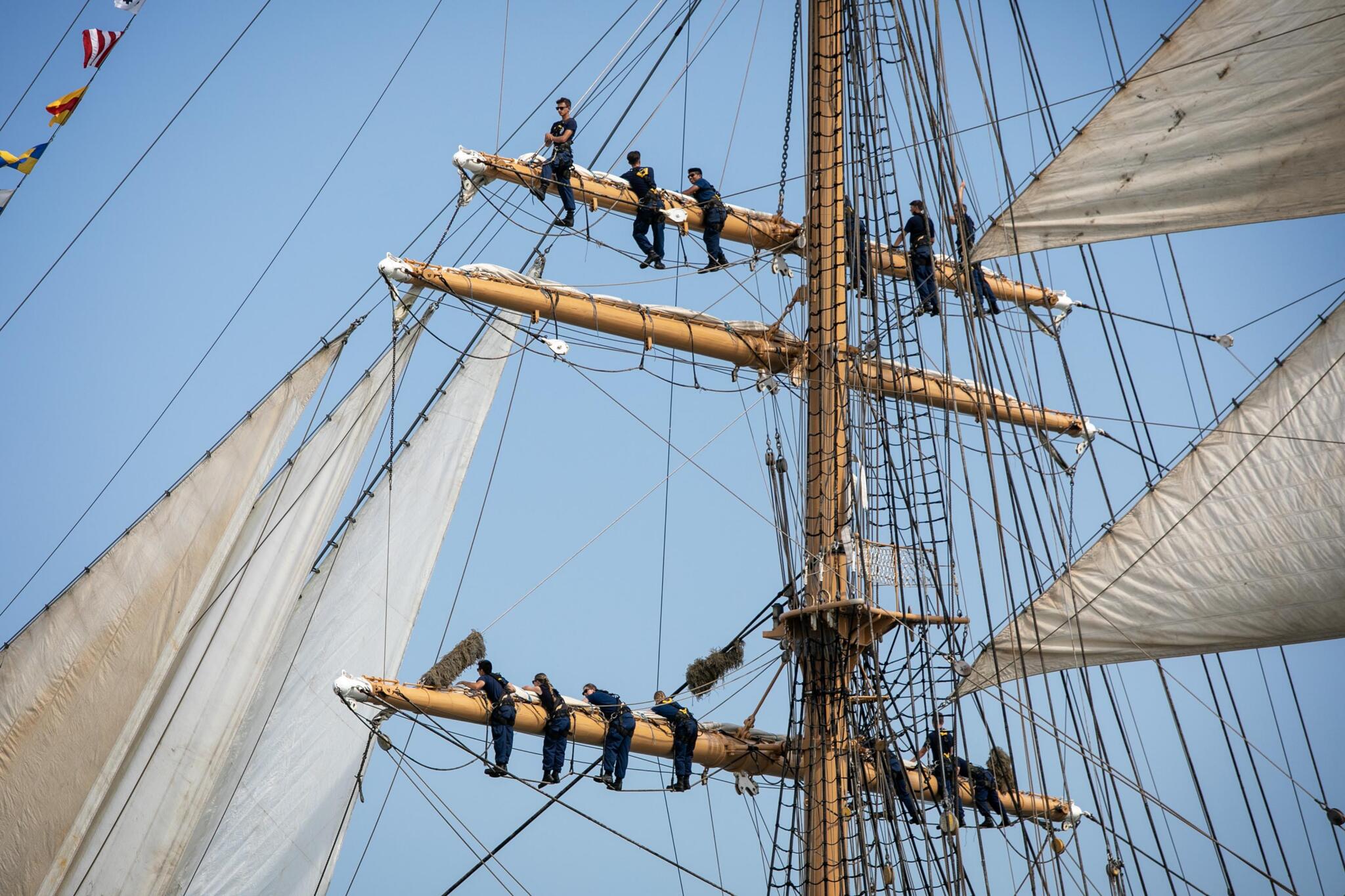 Tall ships fill Boston's outer harbor during the 2026 Parade of Sail.  (Robin Lubbock/WBUR)