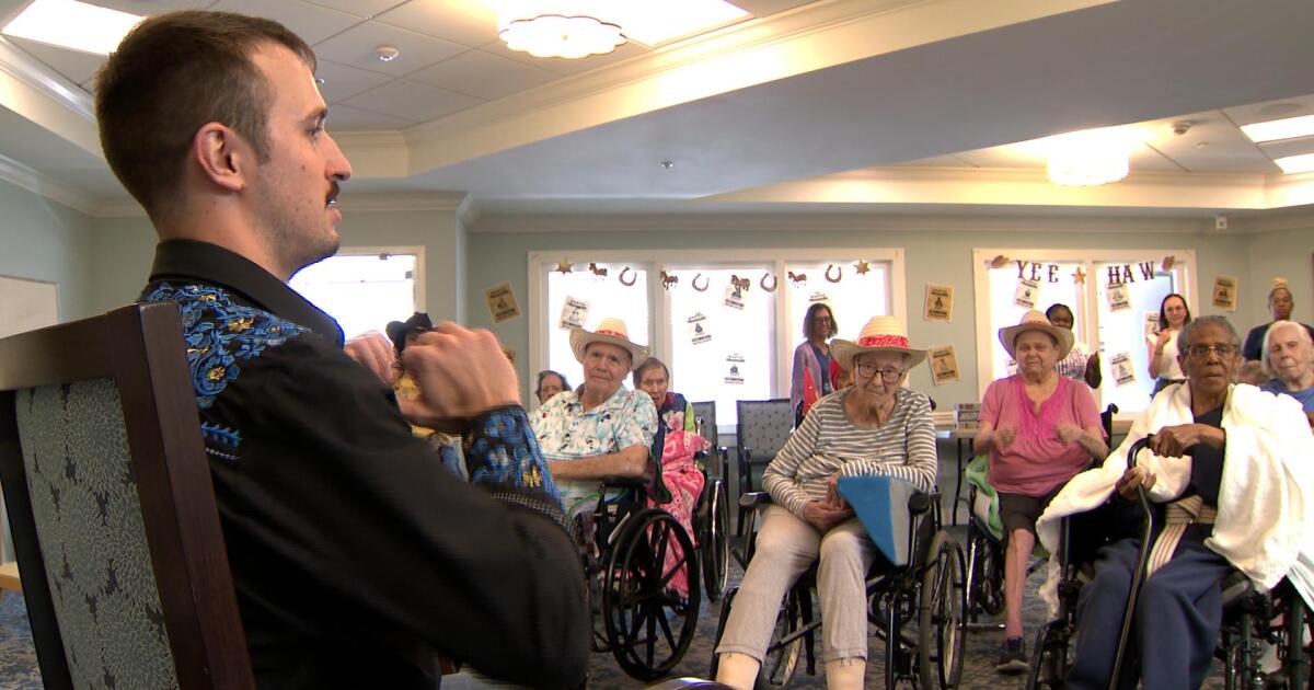 Residents in senior living take part in adapted country line dancing
