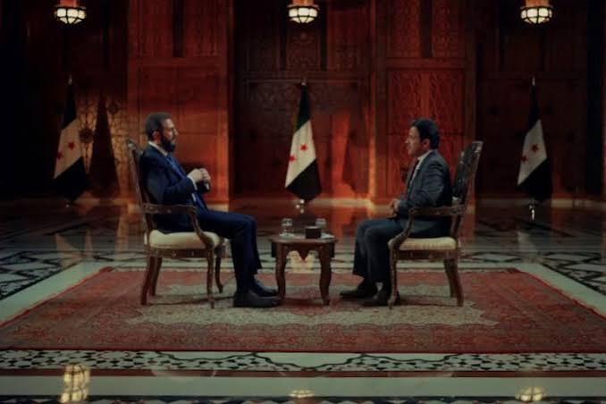 A recent interview on Al Jazeera featuring Ahmad al-Sharaa, head of Syria’s transitional authority, has ignited controversy after the discussion appeared to suggest that global demand for democracy—including within Syria’s future political system—is diminishing.