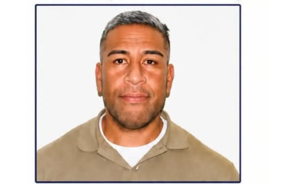 Son of man allegedly murdered by US-linked hitman remains on the run after police custody escape