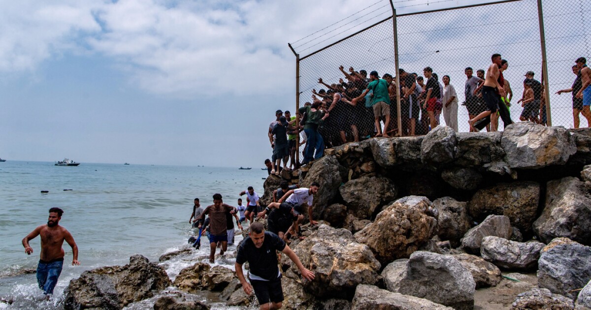 Spain deploys military to Ceuta after thousands of migrants cross from Morocco