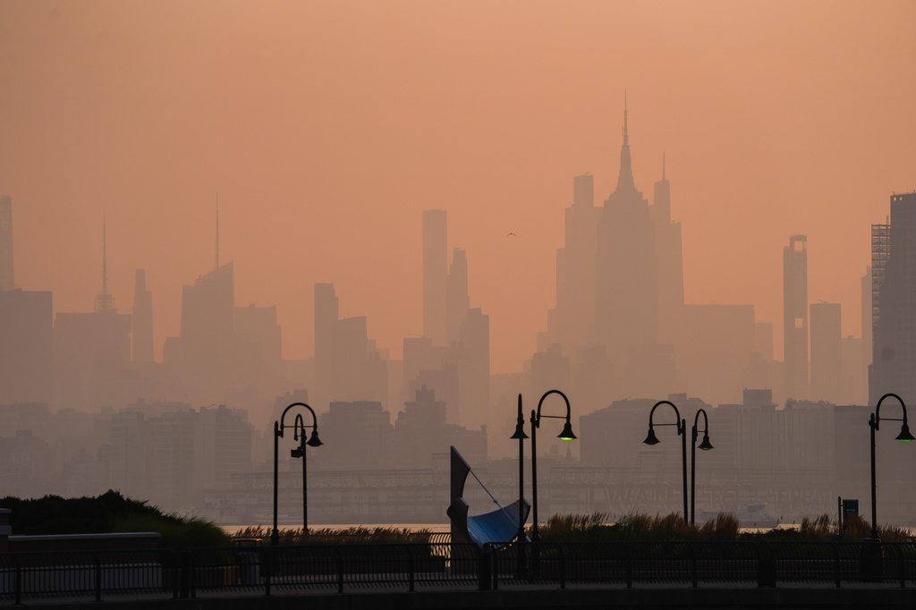 Thunderstorms will clear wildfire smoke from Northeast ahead of World Cup final, meteorologists say
