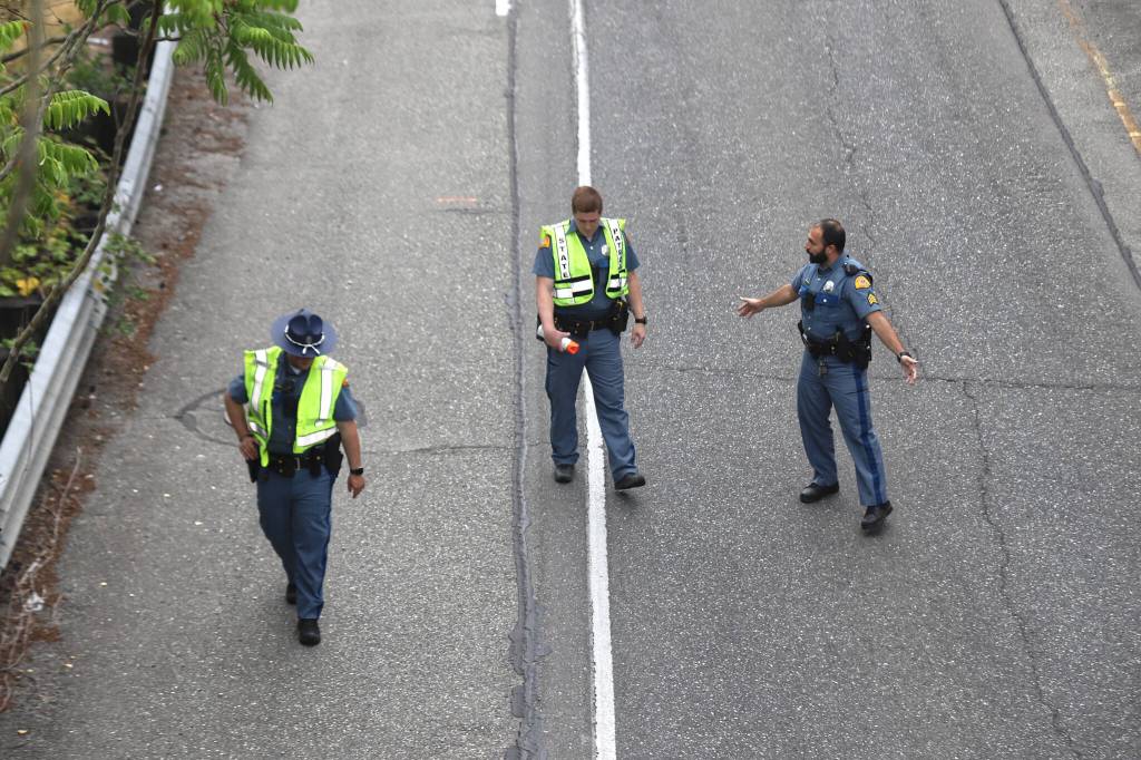 Washington State Highway Patrol troopers conduct an investigation during a closure of U.S. 2 eastbound in Everett on Wednesday evening, July 22, 2026. (Mike Henneke / The Daily Herald)