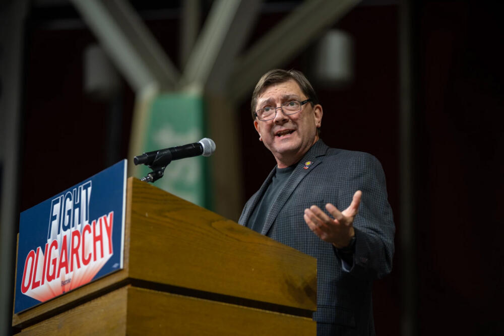 Troy Jackson speaks to a crowd of over 6,000 at a "Fighting Oligarchy" rally at the Cross Insurance Arena in Portland on Labor Day, Monday, Sept. 1, 2025. (Rebecca Conley/Maine Public, file)