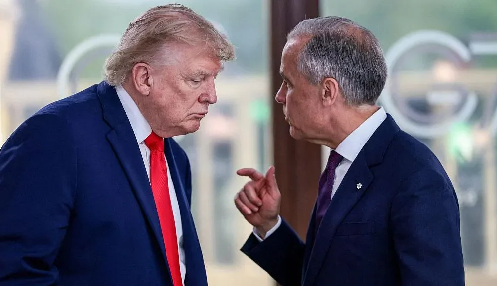 Trump slaps 50% tariffs on Canada and Carney vows to ‘intensify’ trade talks