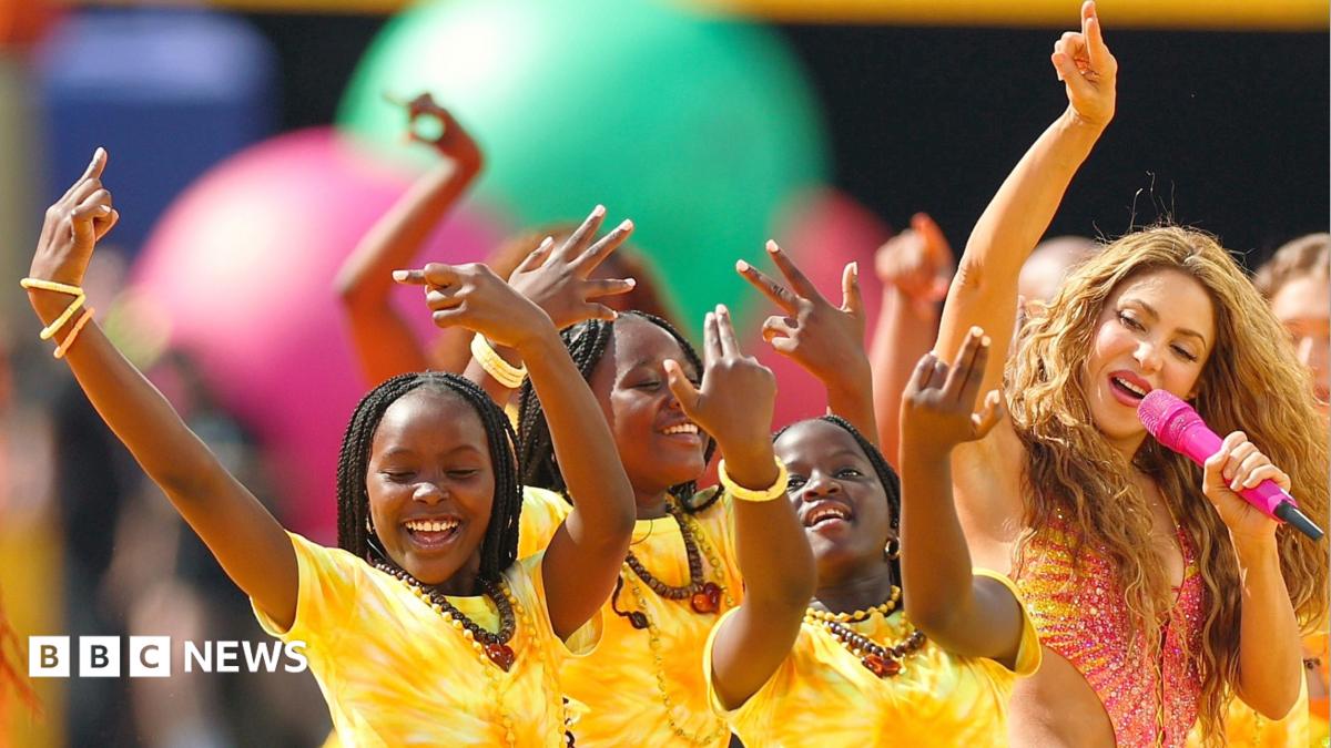 Shakira and Burna Boy perform with Ghetto Kids dancers dressed in yellow during World Cup 2026 final half-time show between Spain and Argentina on 19 July 2026 in New Jersey.
