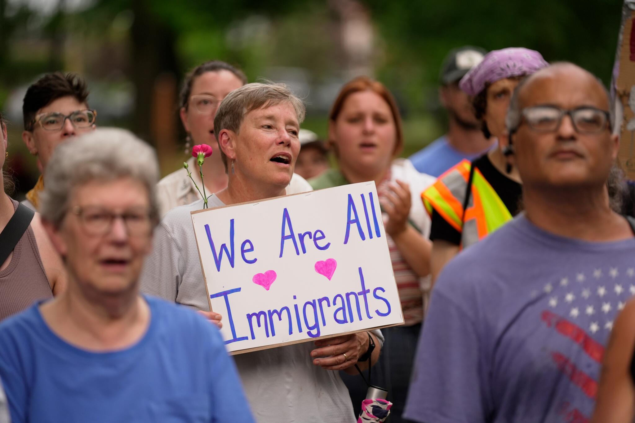 Attendees sing during a vigil in Lewiston, Maine on July 14, 2026.(AP Photo/Robert F. Bukaty)