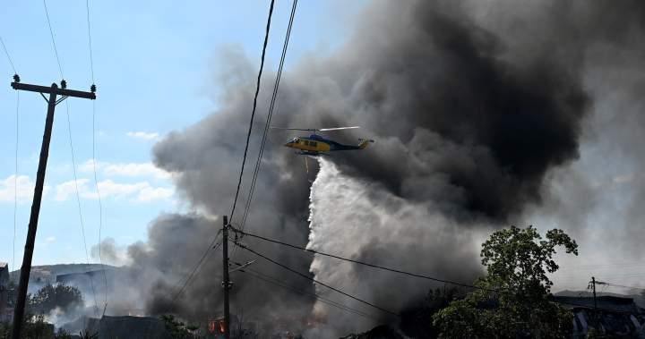 Wildfires rage in Portugal, Greece and Spain while Greek authorities warn of toxic smoke - National