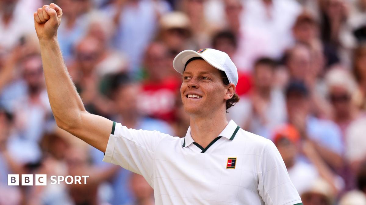 Jannik Sinner celebrates his victory over Novak Djokovic on Centre Court