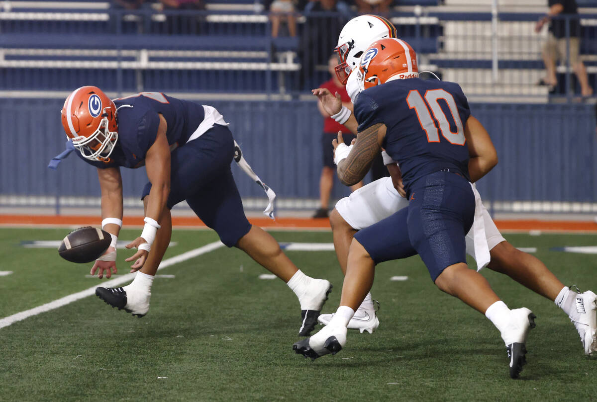 Bishop Gorman's defensive end Caleb Lea'Ea (45) tries to recover a fumbled ball from ...