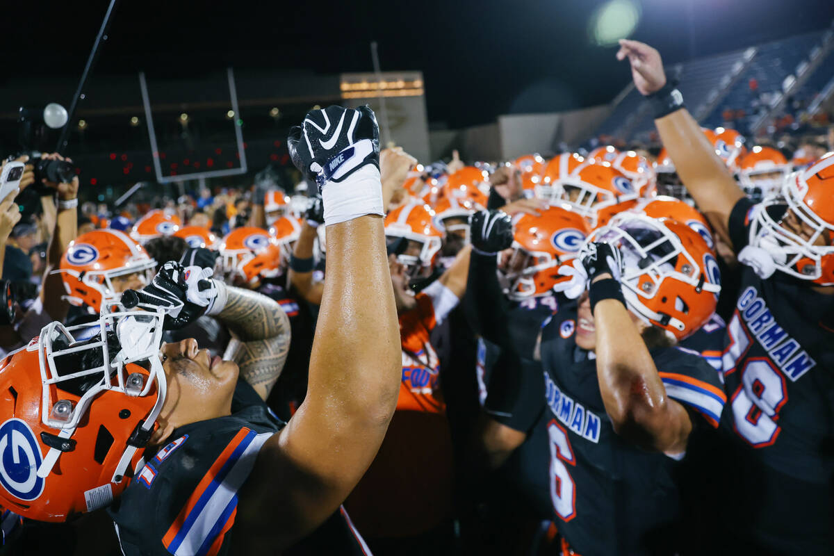 Bishop Gorman players do one last cheer after beating St. John Bosco in the football game on Fr ...