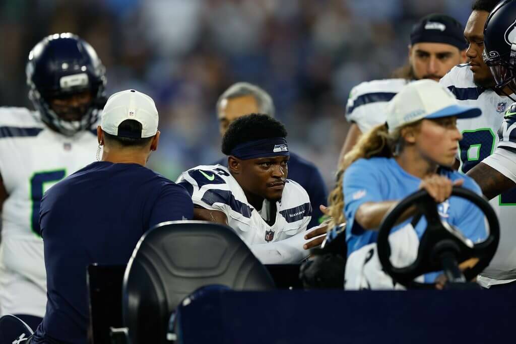 Bud Clark (9) of the Seattle Seahawks is carted off the field injured during the first half of a preseason game against the Tennessee Titans at Nissan Stadium on Sunday, August 23, 2026 in Nashville, Tennessee. (Justin Ford / Getty Images / The Athletic)