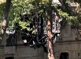 Camper fire leaves woman and bystander who went in to rescue her with injuries