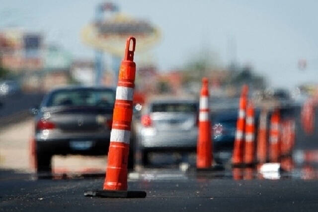 Construction cones on the roadway with cars driving by. (Las Vegas Review-Journal)