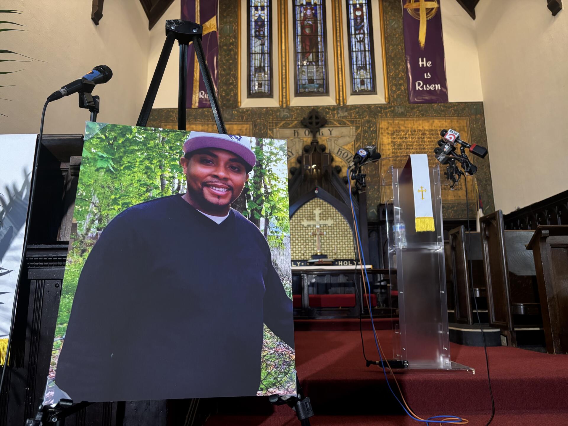 A photo of Stephenson King Jr. displayed at the Roxbury church where his family met with reporters this week. (Eve Zuckoff/WBUR)