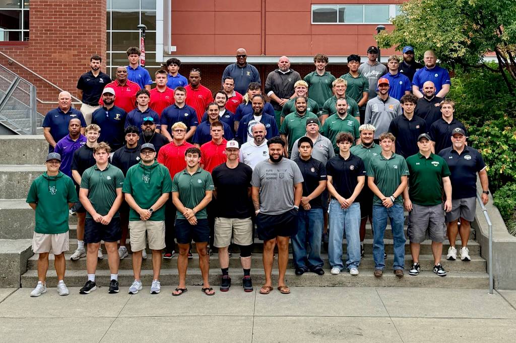 Coaches and players gather for a group photo outside Snohomish High School following Wesco 3A Football Media Day on Aug. 16, 2026. (Photo courtesy Brea Bursch / Snohomish Athletics)