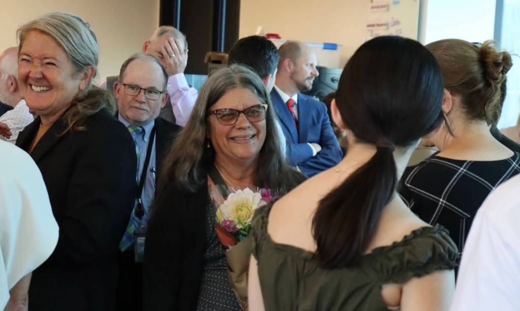 Former Judge Marybeth Dingledy speaks with colleagues and friends during a retirement celebration held for her at the Snohomish County Superior Courthouse on Aug. 20, 2026, in Everett, Washington. (Ian Davis-Leonard / The Herald)