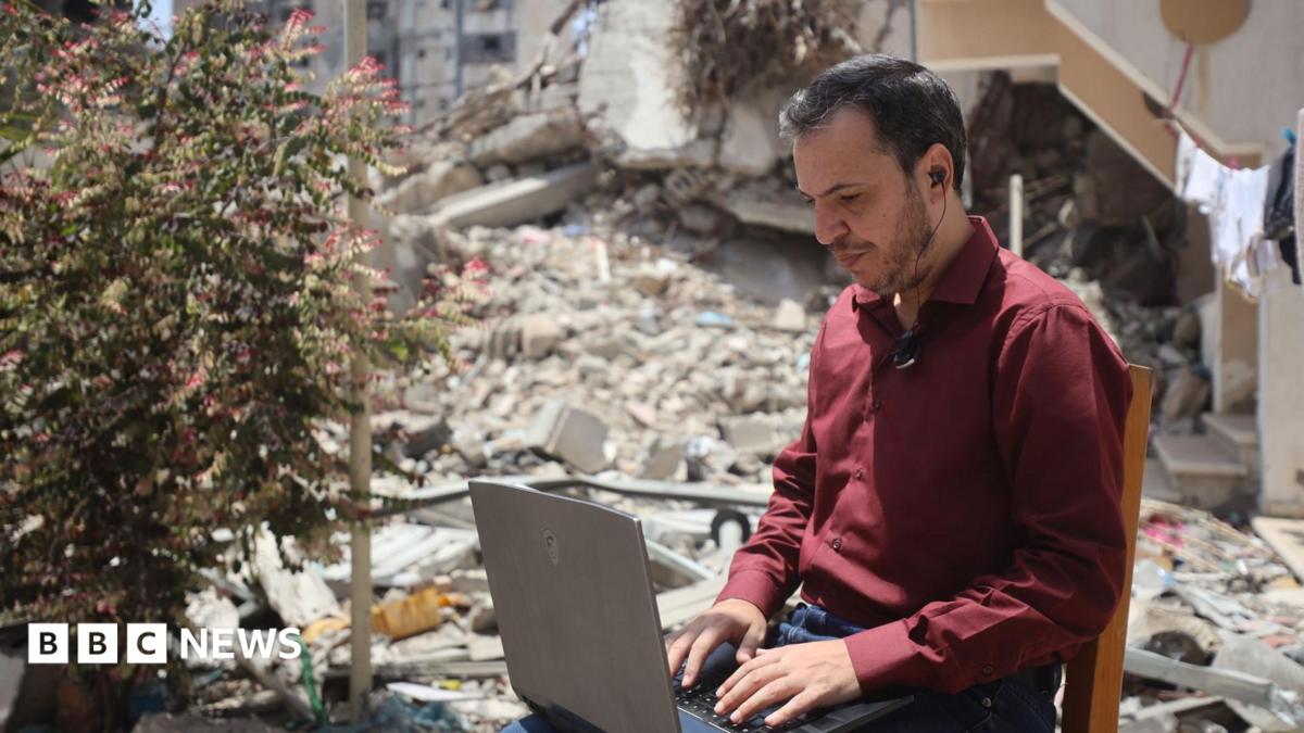 Walaa Volidis, a Palestinian software engineer, works on her laptop in Deir al-Balah, central Gaza
