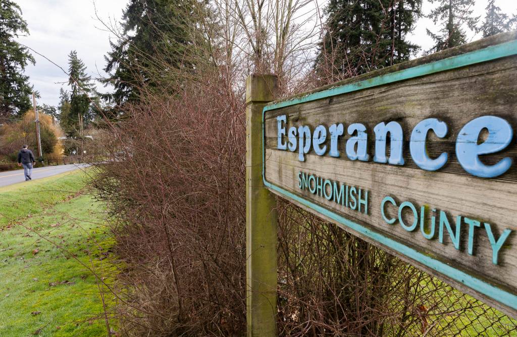 A person walks along 222nd Street Southwest next to Esperance Park on Tuesday, Feb. 3, 2026 in Edmonds, Washington. (Olivia Vanni / The Herald)