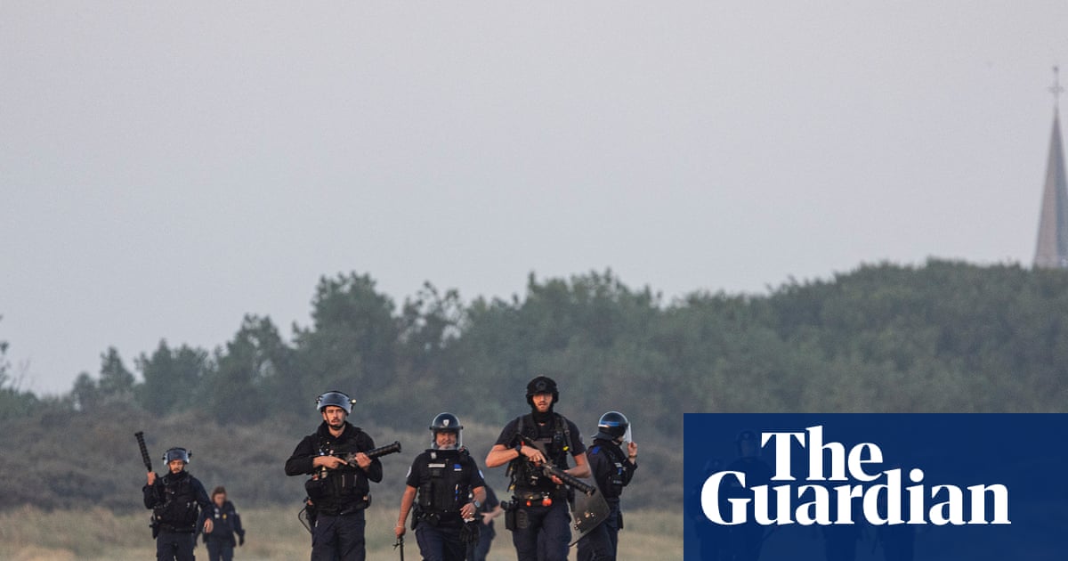 Footage shows clash with French police on beach as dinghy tries to leave for UK | Immigration and asylum
