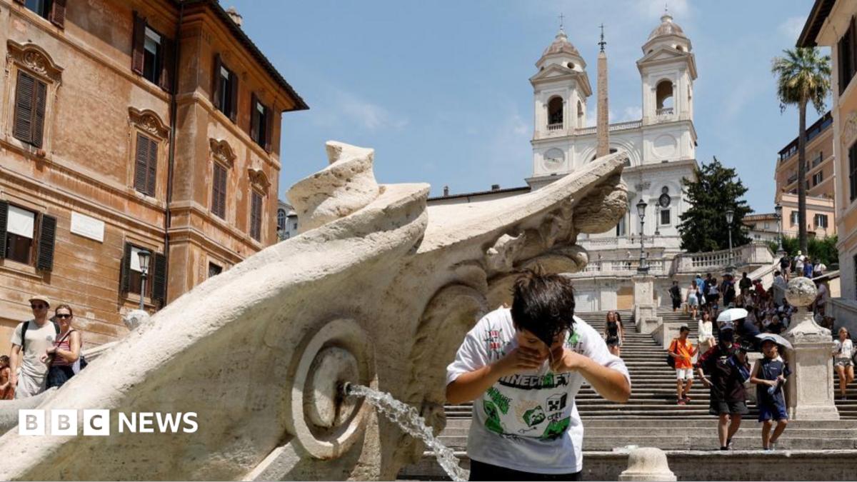 A boy cools off at the Barcaccia fountain near the Spanish steps during a heatwave, as temperatures are expected to rise further in the coming days, in Rome, Italy August 3, 2026.