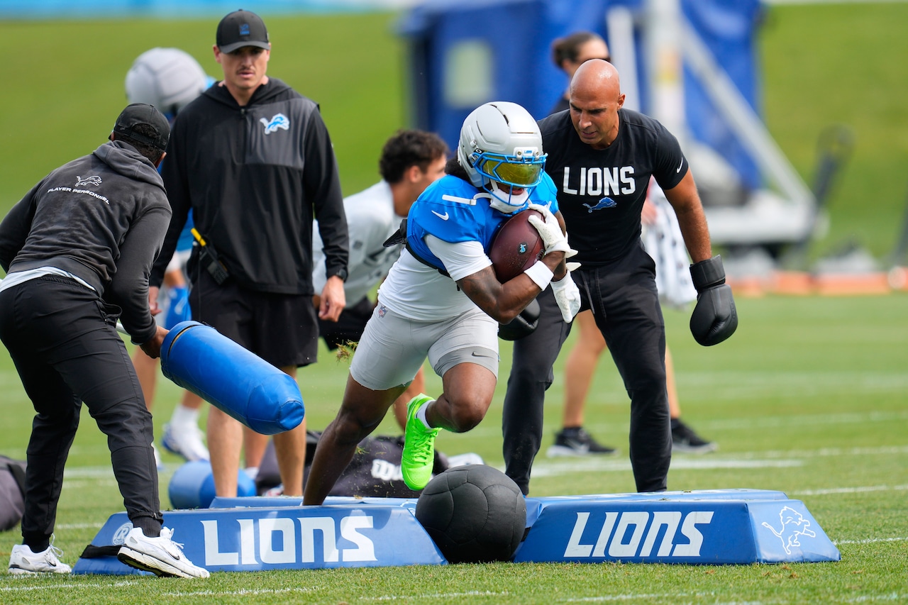Detroit Lions running back Jahmyr Gibbs runs a drill during a training camp practice.