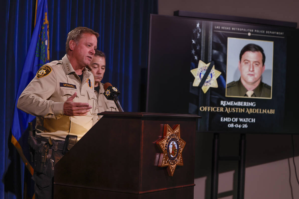 Sheriff Kevin McMahill, left, speaks during a briefing on the death of officer Austin Abdelnabi ...