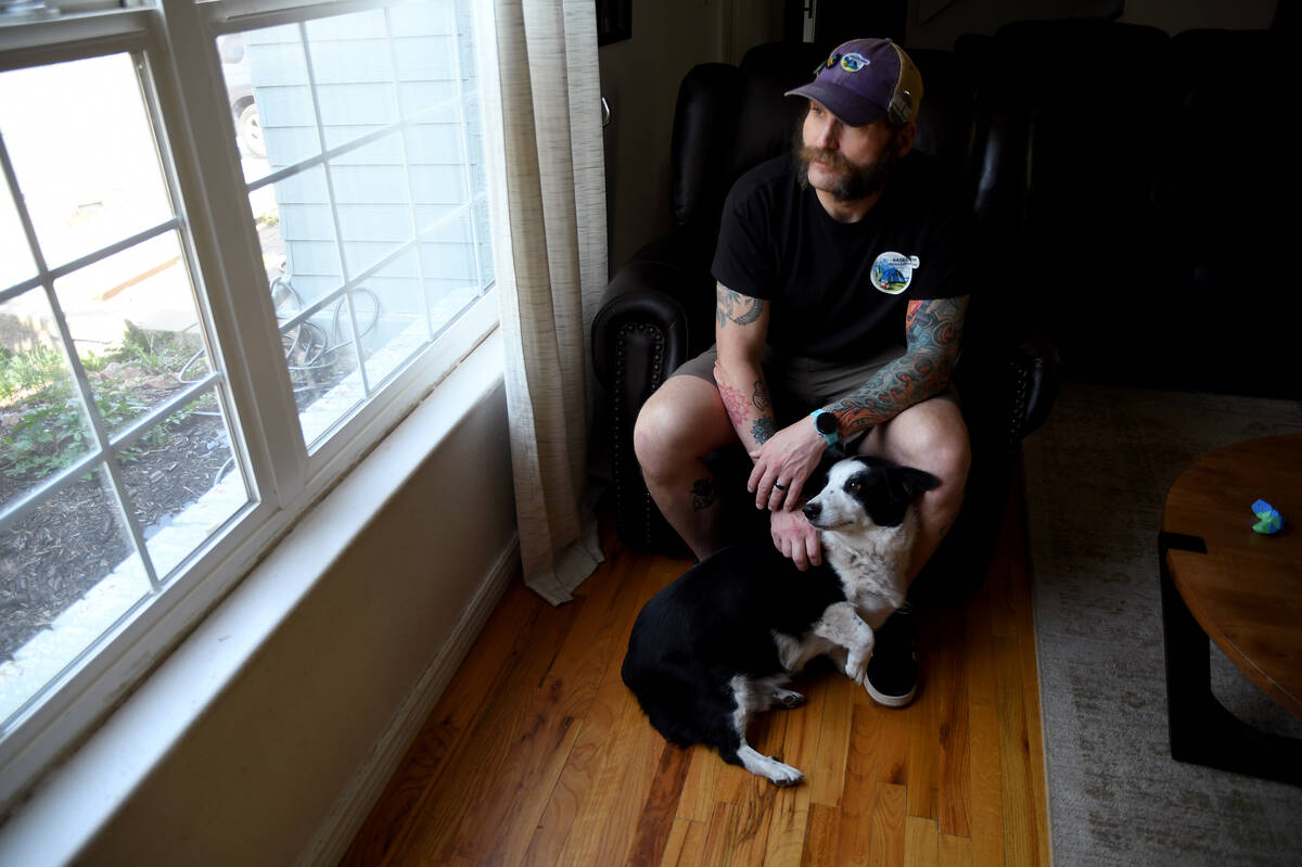 Joe Shearer, who was recently diagnosed with traumatic brain injuries from fighting in Iraq, po ...