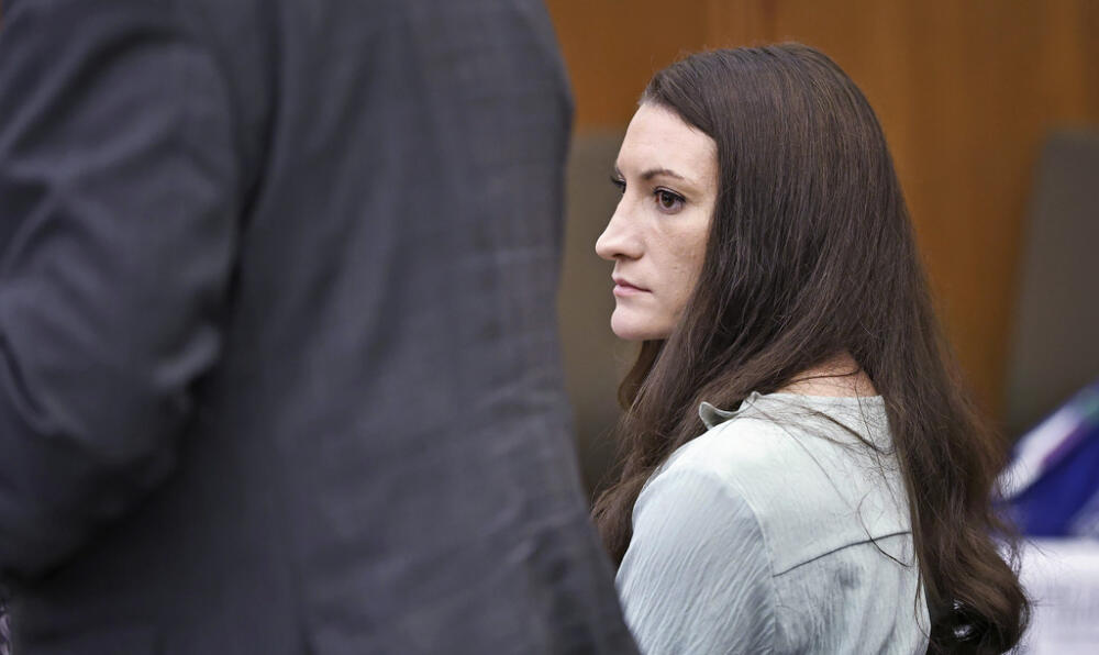 Lindsay Clancy watches the jury enter the room during her murder trial at Plymouth Superior Court on Monday, Aug. 17. (Greg Der/The Patriot Ledger via AP, Pool)
