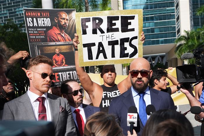 Shackled Tate brothers take stand in court asking to be released from jail during extradition fight