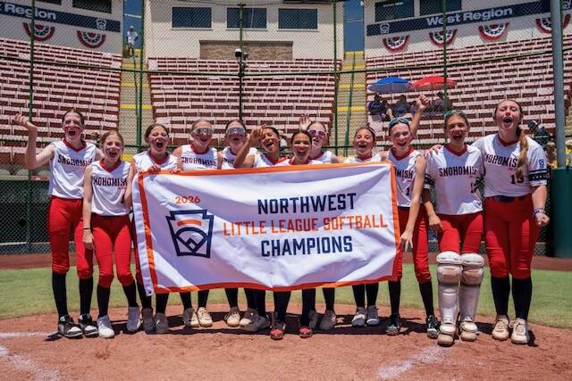 The Snohomish Little League All-Stars hold the Northwest Region championship banner on Thursday, July 23, 2026 at Al Houghton Stadium in San Bernardino, California. (Photo courtesy of Little League Baseball and Softball)