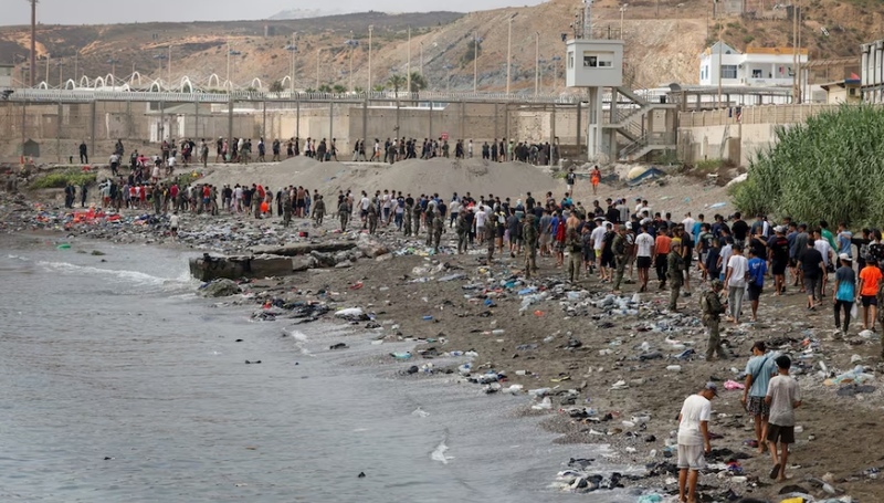 Spain says migrants are returning from Ceuta after 57 die in border rush