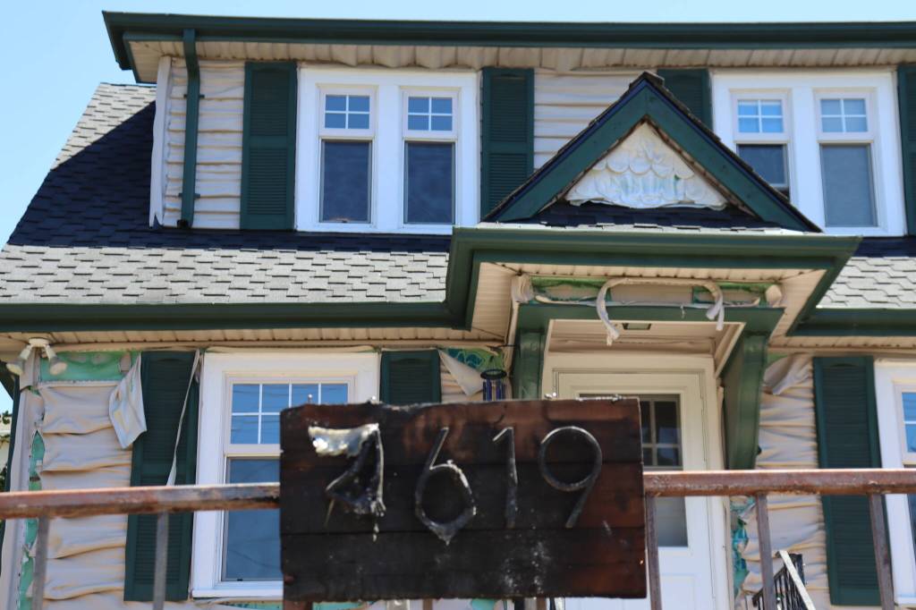 A 100-year-old home on Glenwood Avenue was damaged in a suspected arson after a hedge in the front yard caught fire on July 17, 2026, in Everett, Washington. (Ian Davis-Leonard/The Daily Herald)