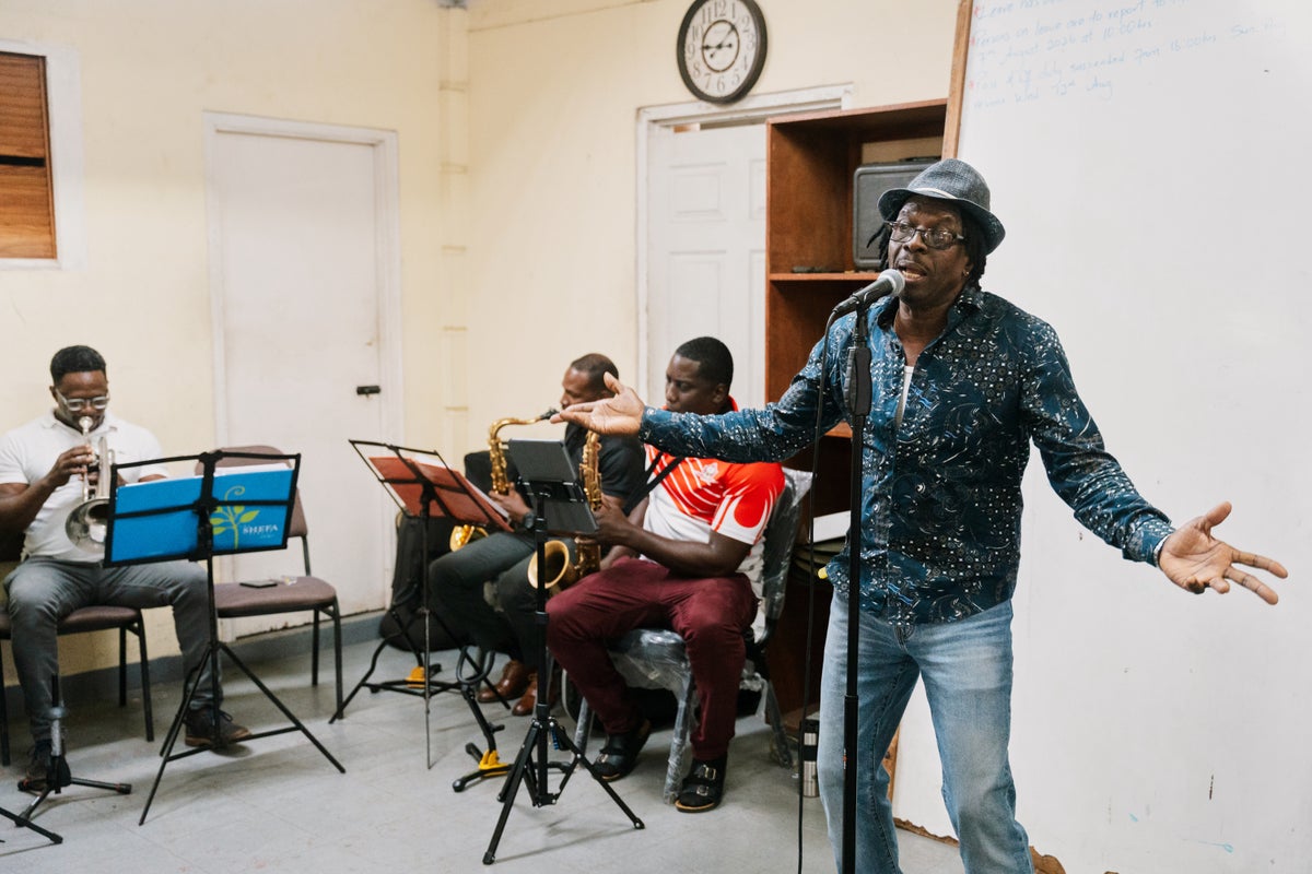 Suspended priest on tiny Caribbean island turns to music to make his voice heard