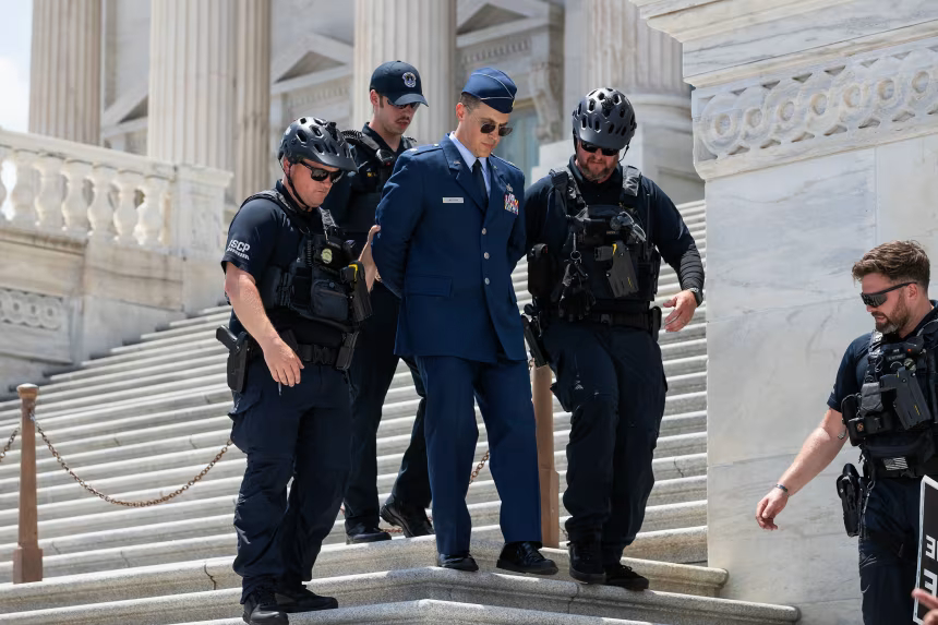 Trump criticism leads to rare criminal charges for Air Force officer who called for impeachment
