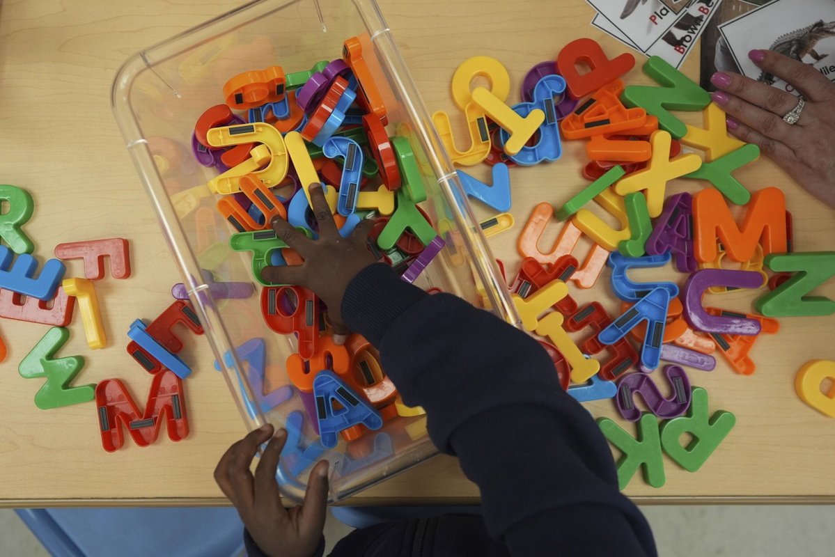 Rebecca Blackwell/AP via CNN NewsourceA student looks for a certain letter during a reading and writing lesson at a Head Start program run by Easterseals