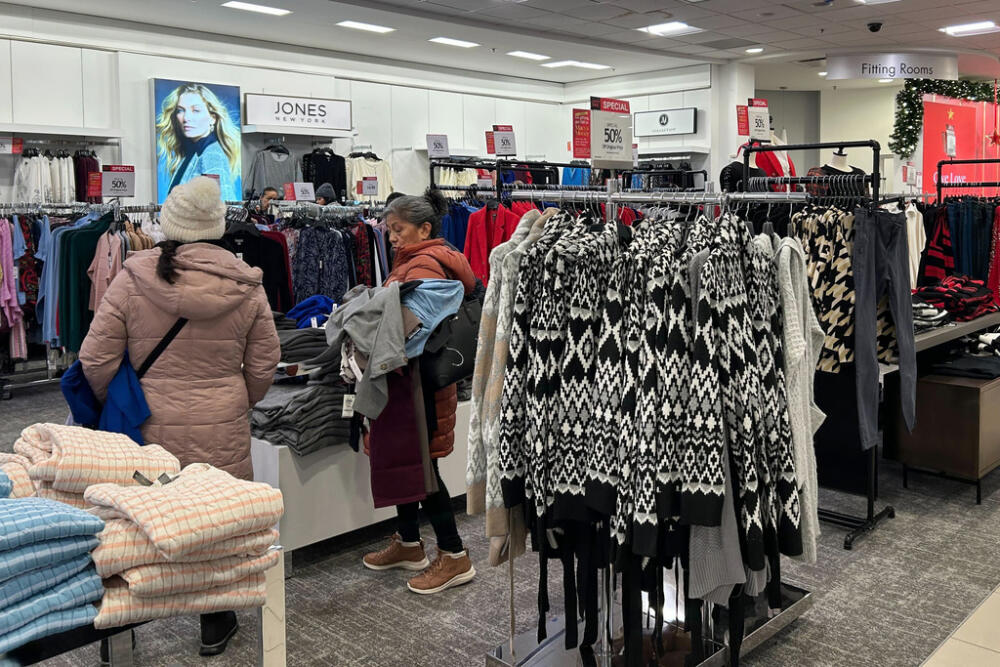 Shoppers look at items displayed at a Macy's store at the Newport Centre mall on Sunday, December 15, 2024 in Jersey City. N.J. (AP Photo/Anne D'Innocenzio)
