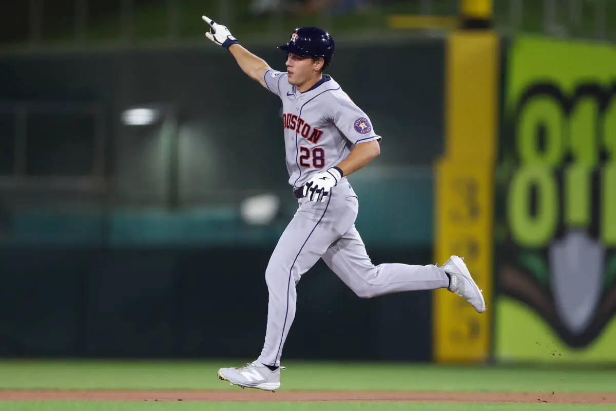 Houston Astros' Lucas Spence jogs around the bases after hitting a solo home run during th ...