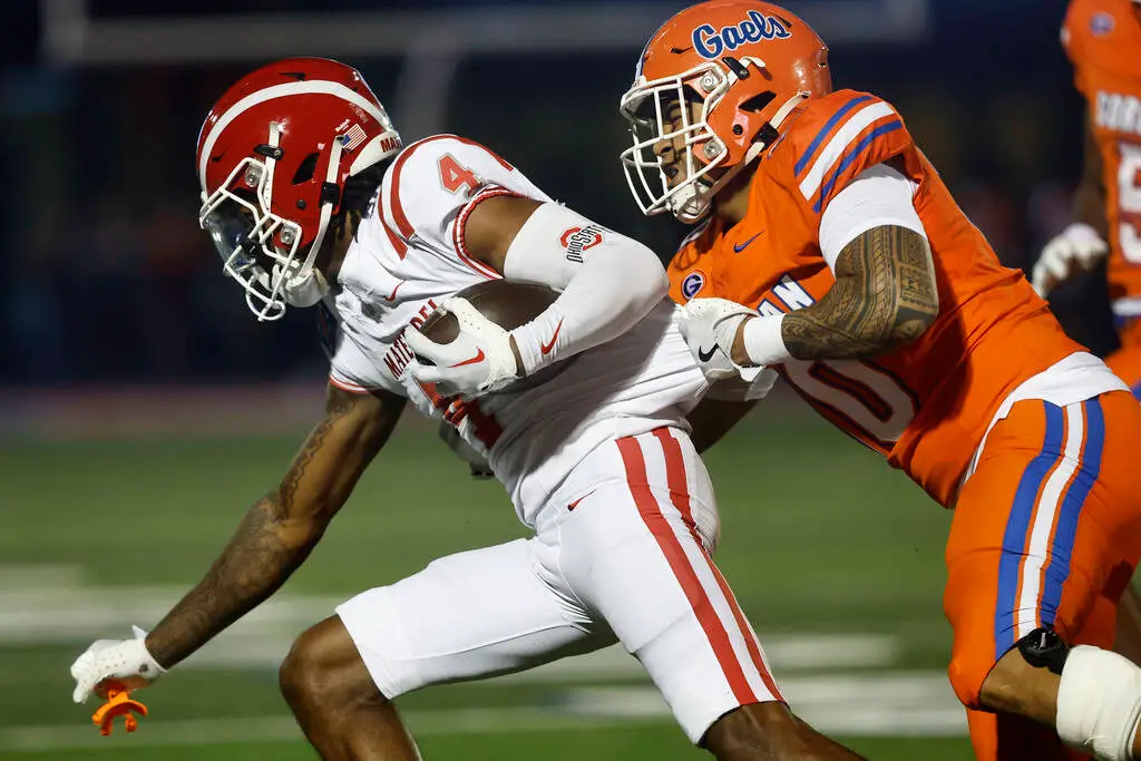 Bishop Gorman linebacker Tamatoa Gaoteote (10) tackles Mater Dei wide receiver Kayden Dixon-Wya ...