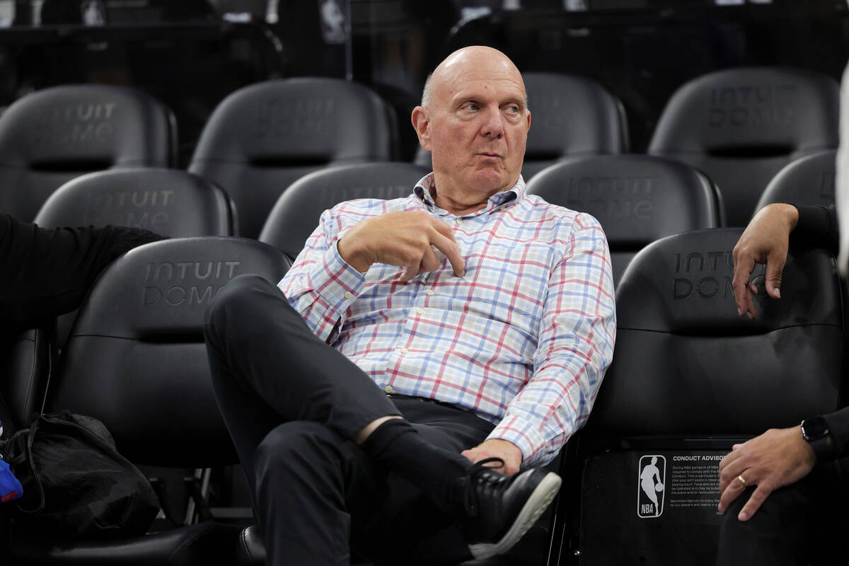 Los Angeles Clippers owner Steve Ballmer sits on the sideline before an NBA basketball game aga ...