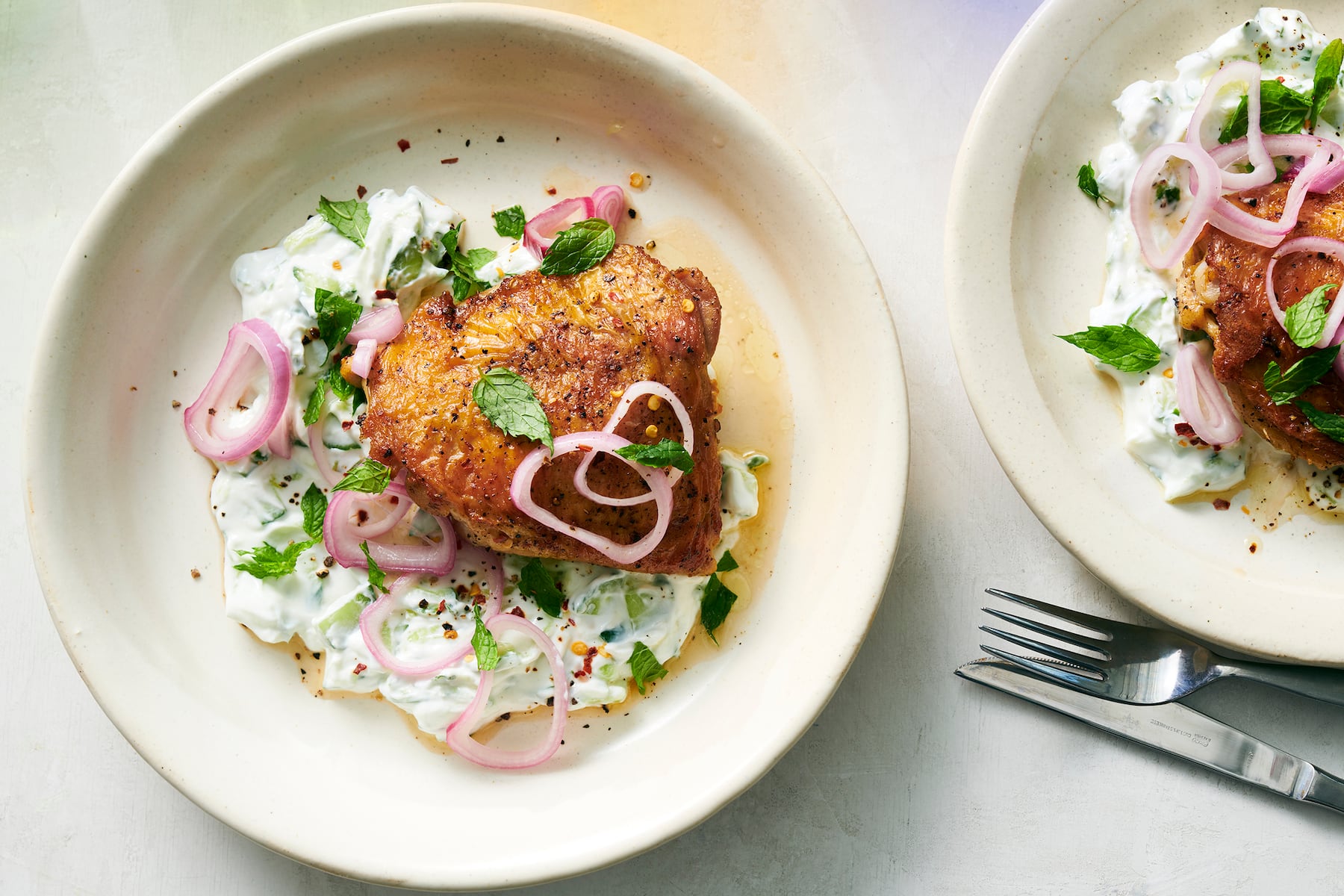 Crispy chicken thighs with cucumber yogurt