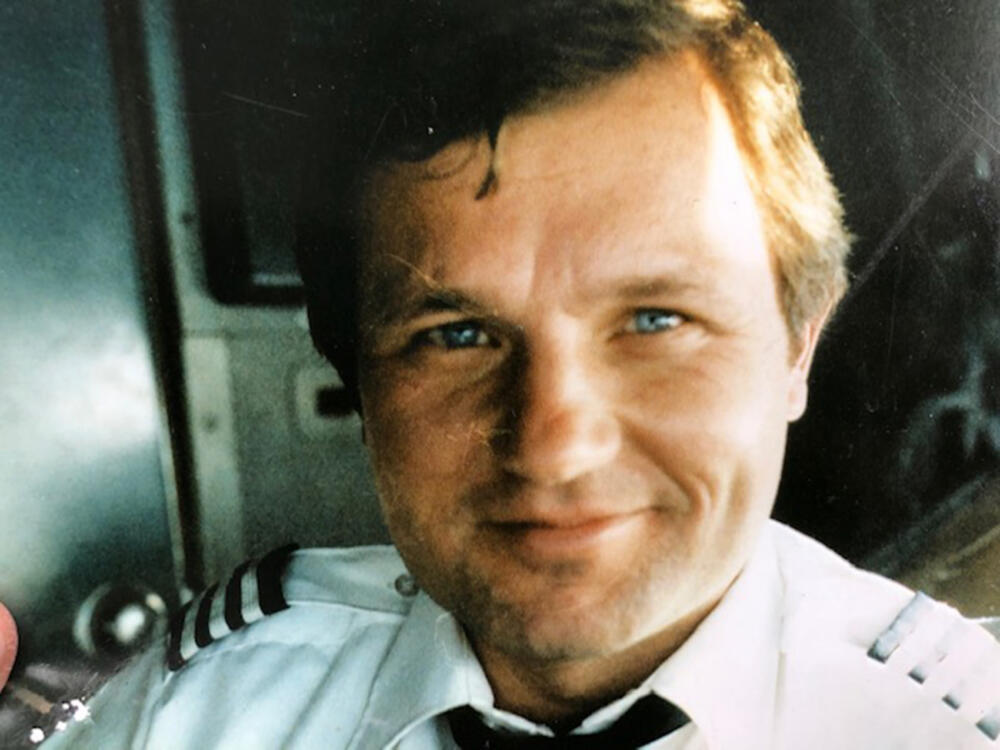 John Ogonowski in his American Airlines uniform in the cockpit of a plane. (Courtesy of Laura Ogonowski)