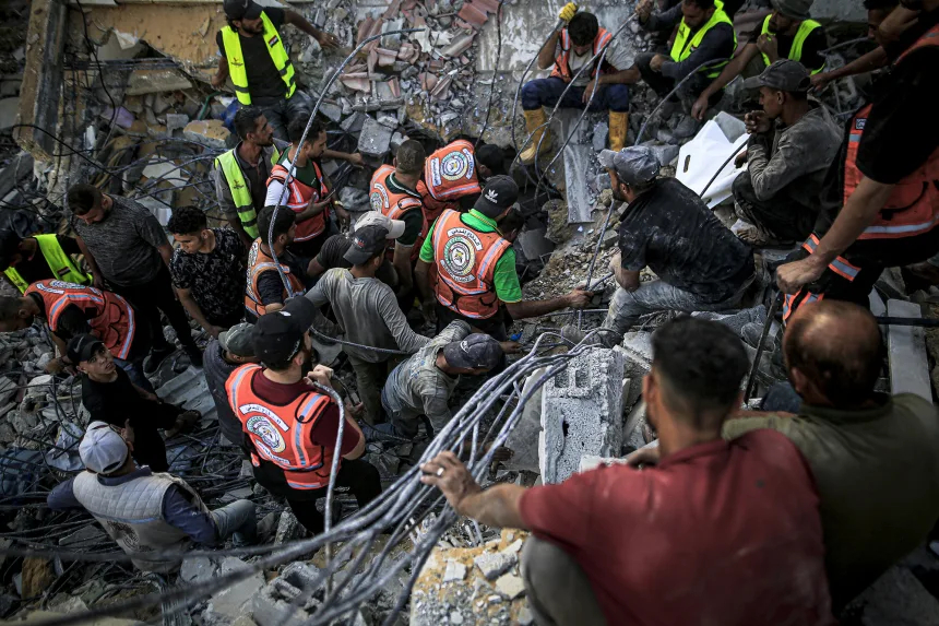 Gaza building collapse kills more than 20, dozens remain trapped under rubble