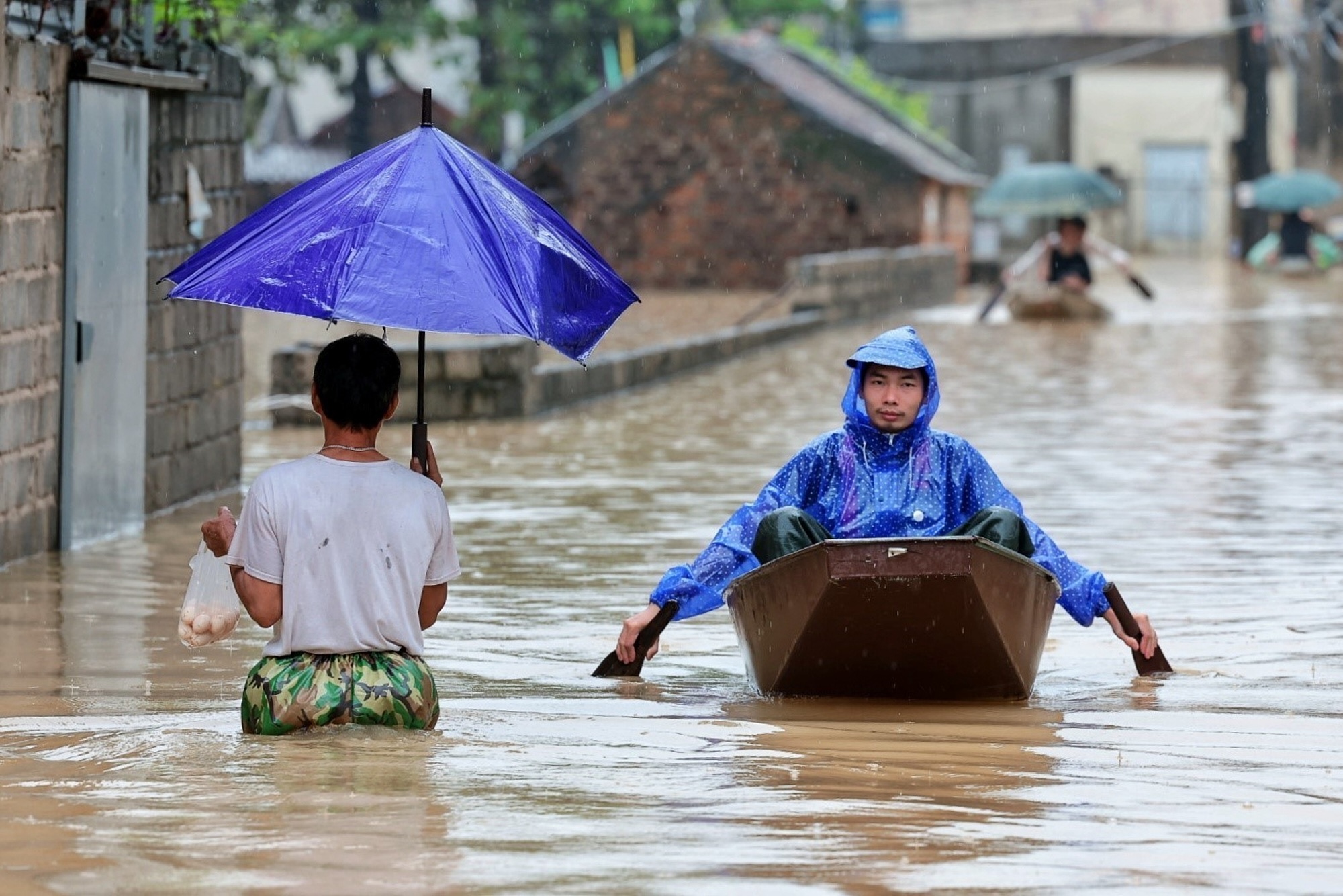 Heavy rain and floods in northern Vietnam submerge homes and disrupt economy