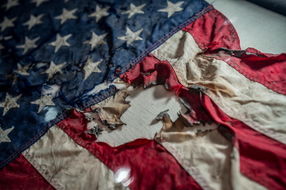 A badly damaged flag recovered from the World Trade Center debris is displayed at the Smithsonian's National Museum of American History. (AP Photo/J. Scott Applewhite/AP)